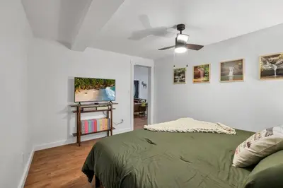 a bedroom with a bed and a ceiling fan at The Silver Birch in Lancaster