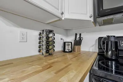 a kitchen with a counter top with wine bottles at The Silver Birch in Lancaster