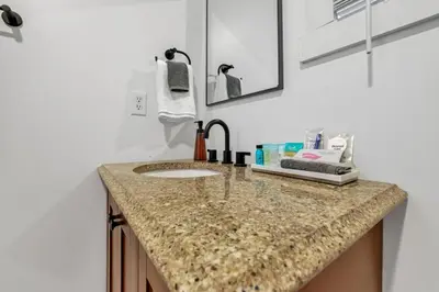 a bathroom counter with a sink and a mirror at The Silver Birch in Lancaster