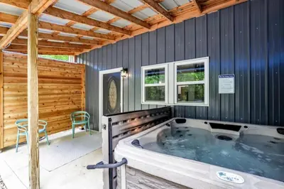a hot tub in a room with a wooden ceiling at The Silver Birch in Lancaster