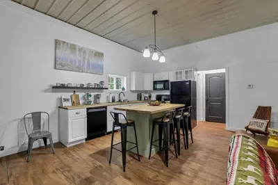 a kitchen with a table and chairs in a room at The Silver Birch in Lancaster