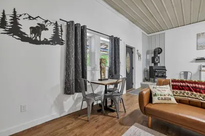 a living room with a table and a couch at The Silver Birch in Lancaster