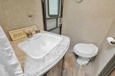 a bathroom with a sink and a toilet at Chestnut Camper in Lancaster