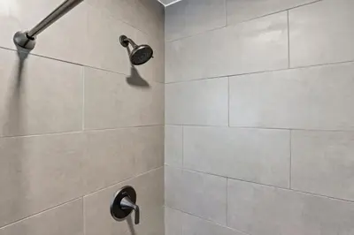 a shower with a shower head in a bathroom at The Blue Spruce in Lancaster