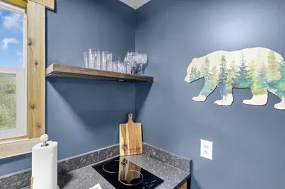 a bathroom with a painting of a bear on the wall at The Blue Spruce in Lancaster