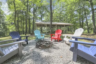 a group of chairs sitting around a fire pit at The Maple Cabin in Lancaster