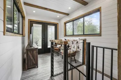 a home office with a chair and a table at Hiltop Haven The Double Stack in Logan