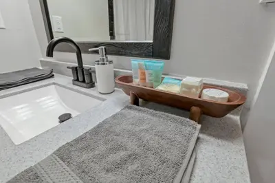 a bathroom with a sink and a bath tub at Nostalgic in Nelsonville in Nelsonville