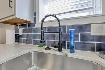 a kitchen sink with a black kitchen faucet at Nostalgic in Nelsonville in Nelsonville