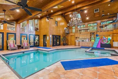 an indoor pool in a house with a ceiling fan at Daisy Glen Retreat - Amazing Indoor Pool in South Bloomingville