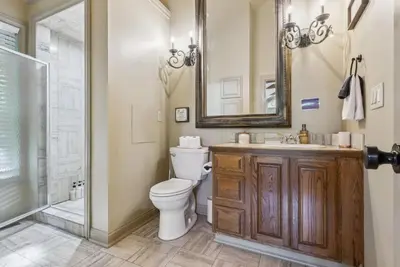 a bathroom with a toilet and a sink and a shower at Daisy Glen Retreat - Amazing Indoor Pool in South Bloomingville