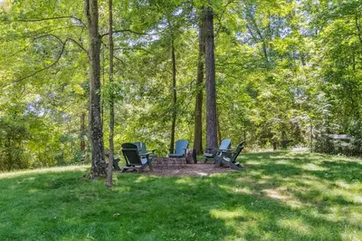 a group of chairs sitting in the grass at Hike Away Hills in Logan