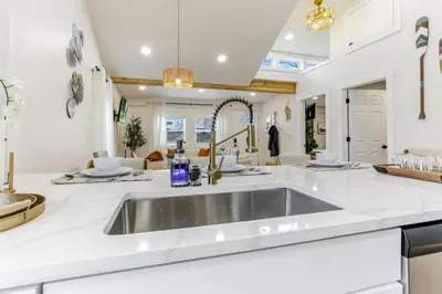 a kitchen with a sink in a white counter top at Gone Fishin in Buckeye Lake