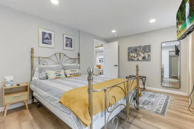 a bedroom with a bed and a mirror at Gone Fishin in Buckeye Lake