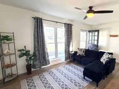 a living room with a couch and a ceiling fan at Ranch-3 Bedroom-Pet & Kid-Fenced -EV Charging-King Bed in Gahanna