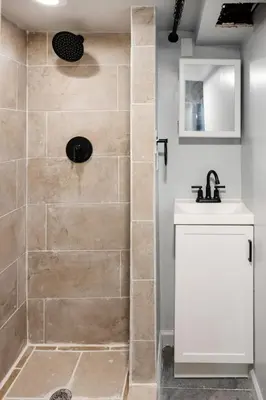 a bathroom with a shower with a sink at Euclid Near Lake Erie Cleveland king bed in Euclid
