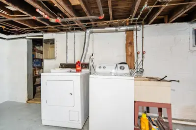 a kitchen with a washing machine in a room at Cuyahoga Falls 3 bedroom 2 bath in Cuyahoga Falls