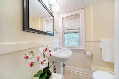 a bathroom with a sink and a mirror at Cuyahoga Falls 3 bedroom 2 bath in Cuyahoga Falls