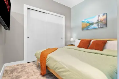 a bedroom with a bed and a large window at 1BR • City View • Huntington • King Bed • 2 TVs in Cleveland