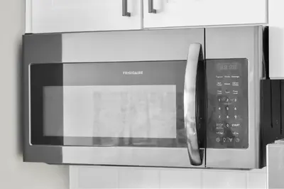 a microwave oven hanging on a kitchen wall at 1BR • City View • Huntington • King Bed • 2 TVs in Cleveland