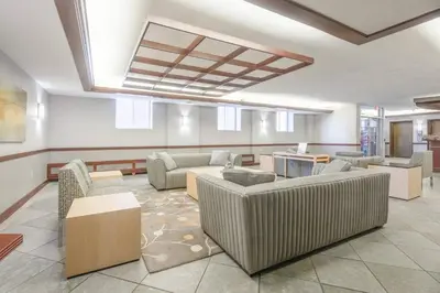 a living room with couches and tables in a building at 1BR • City View • Huntington • King Bed • 2 TVs in Cleveland