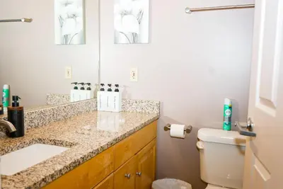 a bathroom with a sink and a toilet at Little Peaceful Loft in Cleveland