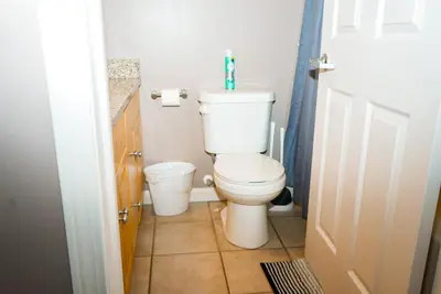 a bathroom with a toilet and a sink at Little Peaceful Loft in Cleveland