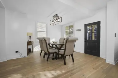 a dining room with a table and chairs at Victorian Villa in Columbus