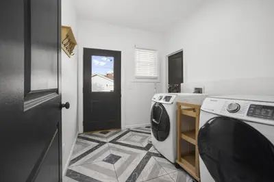 a laundry room with a washer and dryer at Victorian Villa in Columbus