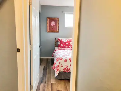 a bedroom with a bed with a pink pillow at 3BR Home, Pet-Friendly, Fenced Yard Near I-70, I-75, Hospitals, Wright-Patt AFB in Dayton