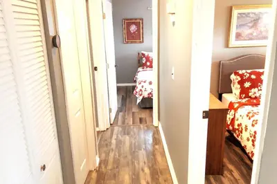 a hallway leading to a bedroom with a bed at 3BR Home, Pet-Friendly, Fenced Yard Near I-70, I-75, Hospitals, Wright-Patt AFB in Dayton