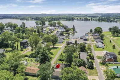 an aerial view of a small town by the water at Quaint Cottage in Thornville