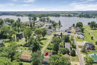 an aerial view of a small town by the water at Quaint Cottage in Thornville