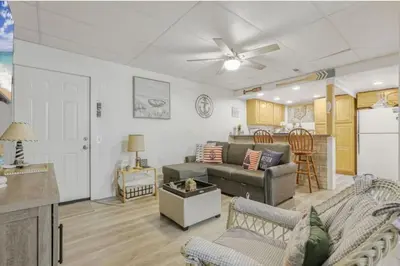 a living room with a couch and a table at Quaint Cottage in Thornville