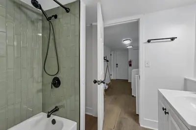 a bathroom with a shower and a sink at Mirror Pond Cabins in Rockbridge
