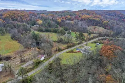 an aerial view of a road in a forest at Mirror Pond Cabins in Rockbridge