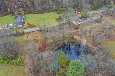 an aerial view of a bridge over a river at Mirror Pond Cabins in Rockbridge
