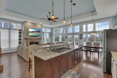 a large kitchen with a large island with a counter top at The Lakehouse in Buckeye Lake