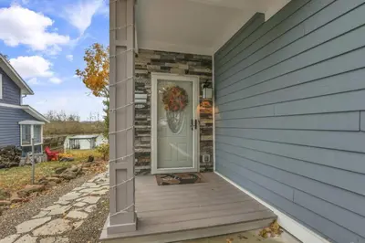 a front door of a house with a porch at The Lakehouse in Buckeye Lake