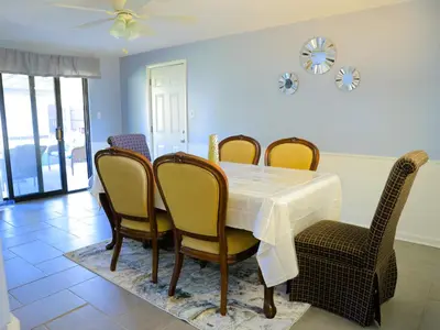 a dining room with a table and chairs at A Nice and Cozy Home in Fairborn in Fairborn