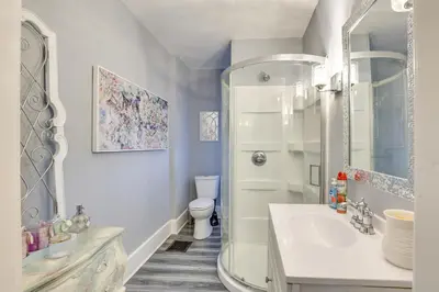 a bathroom with a shower and a sink and a toilet at Canton Condo Near Football Hall of Fame and Dtwn! in Canton