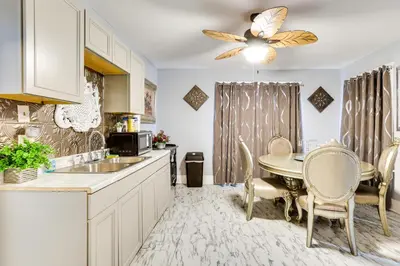 a kitchen with a table and a dining room at Canton Condo Near Football Hall of Fame and Dtwn! in Canton
