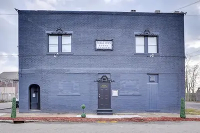 a blue brick building with a sign on it at Canton Condo Near Football Hall of Fame and Dtwn! in Canton