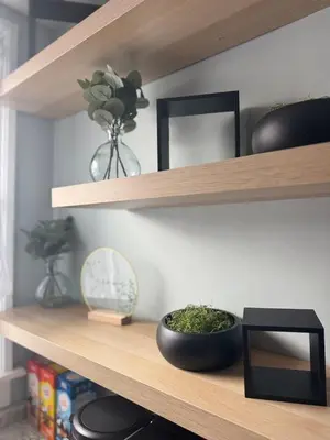 a wooden shelf with a bowl of plants on it at 3 bed room 5 beds 1 bath sleeps 6 guest in Hamilton