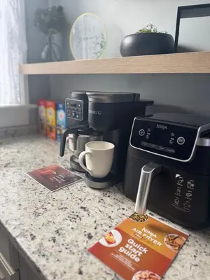 a kitchen counter with a coffee maker and a box on it at 3 bed room 5 beds 1 bath sleeps 6 guest in Hamilton