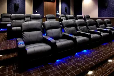 a row of black leather chairs in a room at Courtyard by Marriott Akron Downtown in Akron