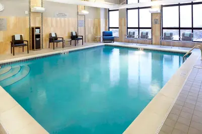 a large swimming pool with blue water at Courtyard by Marriott Akron Downtown in Akron