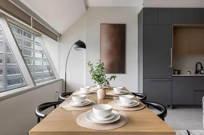 a dining room table with cups and saucers on it at Resort Style Property 2B 2B walk to Everything! in Cleveland