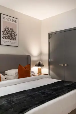 a bedroom with a large bed with a sliding glass door at Resort Style Property 2B 2B walk to Everything! in Cleveland