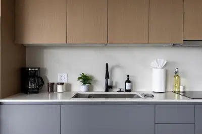 a kitchen with a sink and a counter top at Luxury Downtown King Bed, Rooftop Pool in Cleveland